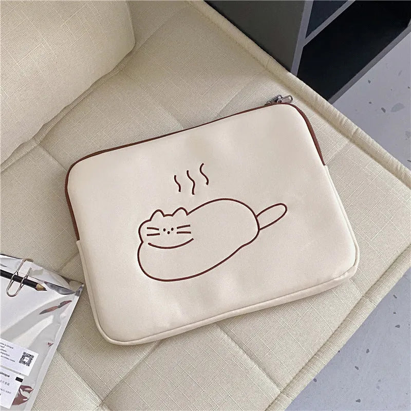 Embroidered fat cat design on a grey nylon tablet protective sleeve with a black zipper.