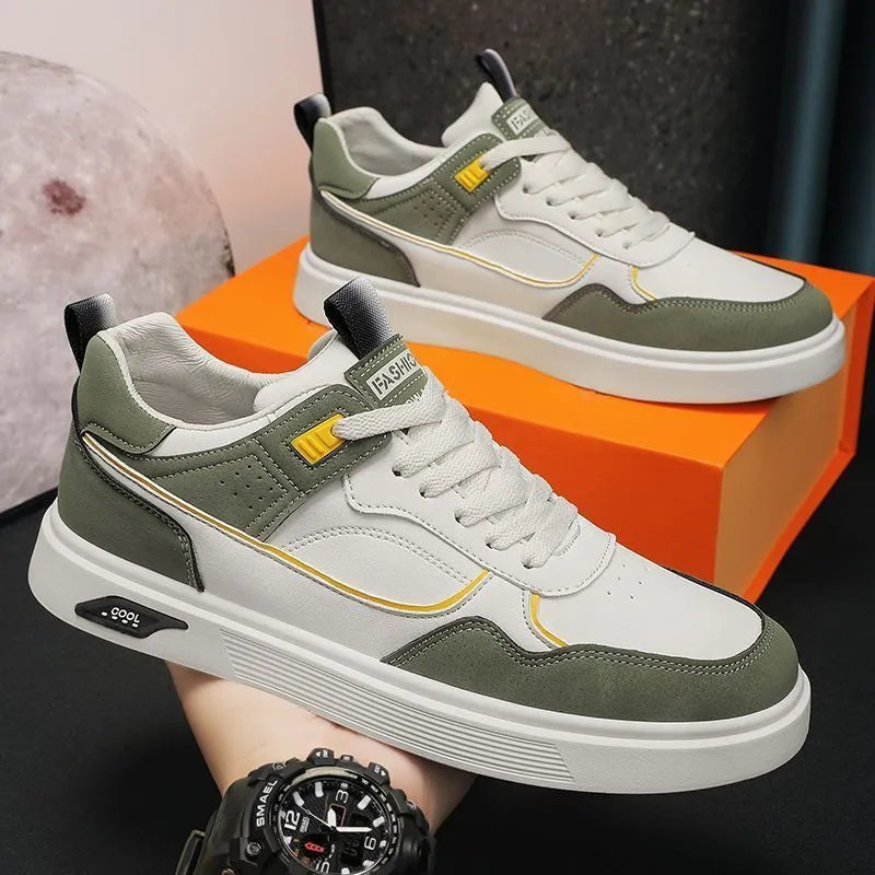 Men's low-top casual canvas shoes in beige with leather stitching detail on a white background.