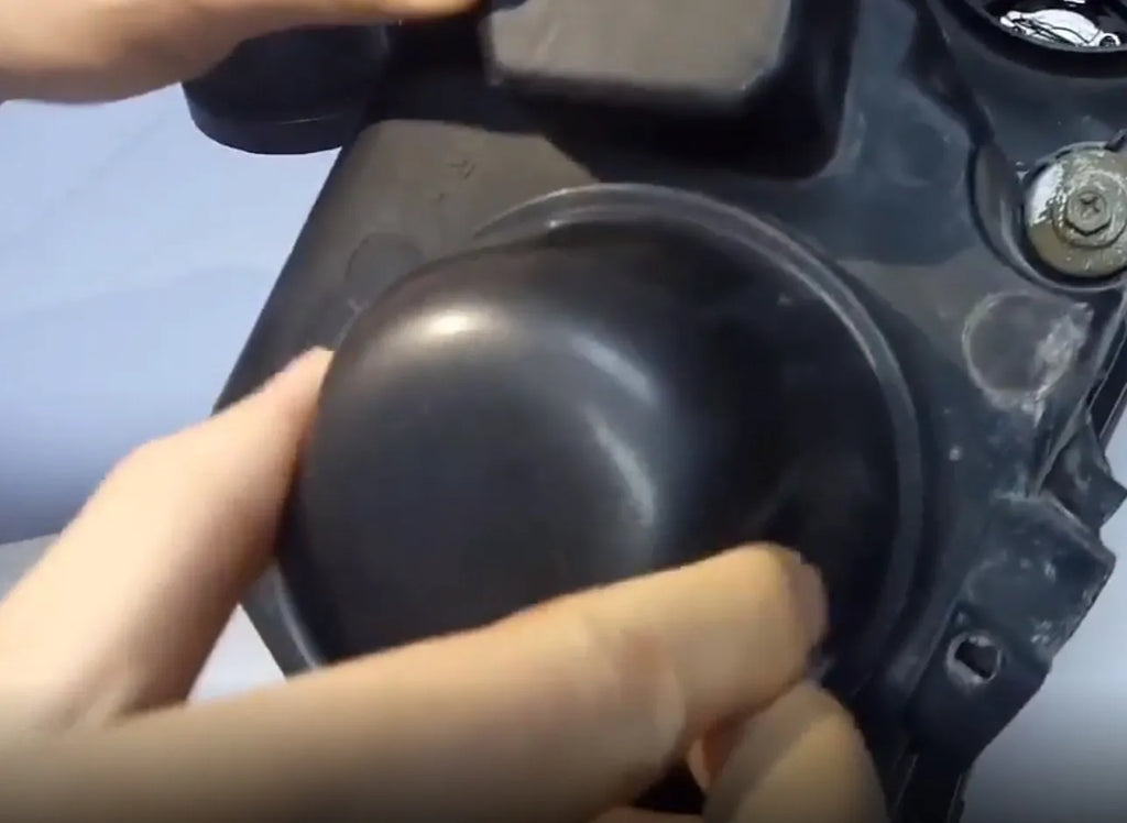 Black silicone dust cover for General Motors LED headlights measuring 90mm diameter