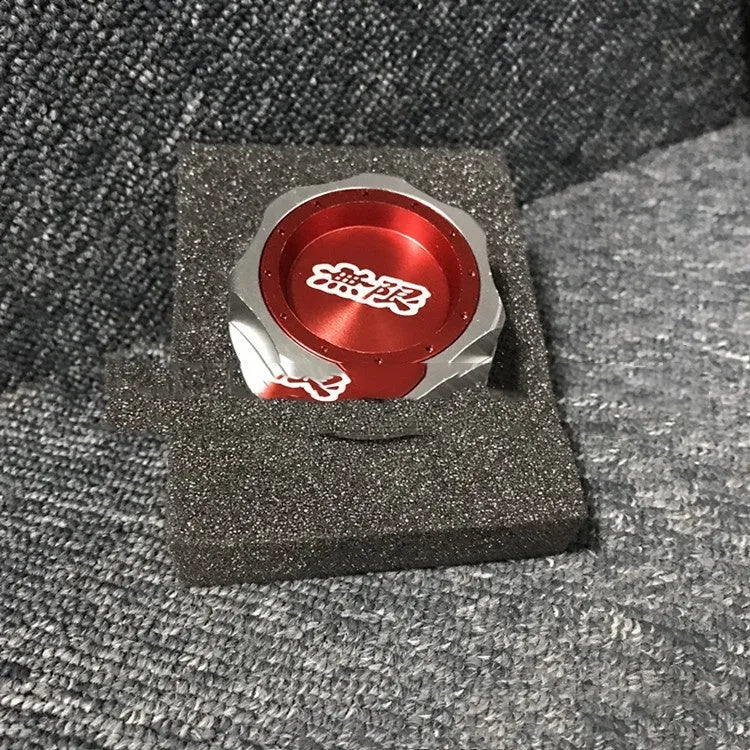 Aluminium alloy oil filter cap for Honda vehicles in assorted colours on a dark background.