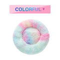 Fluffy donut-shaped pet bed in long plush fabric, showing raised rim, available in multiple colours.