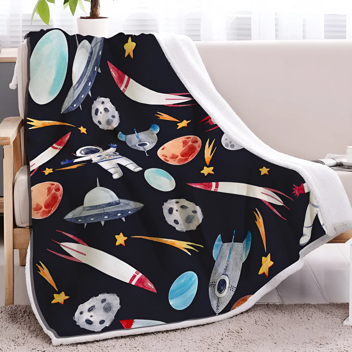 Black astronaut themed sherpa fleece blanket with hemmed edges, available in 130x150cm and 150x200cm sizes.