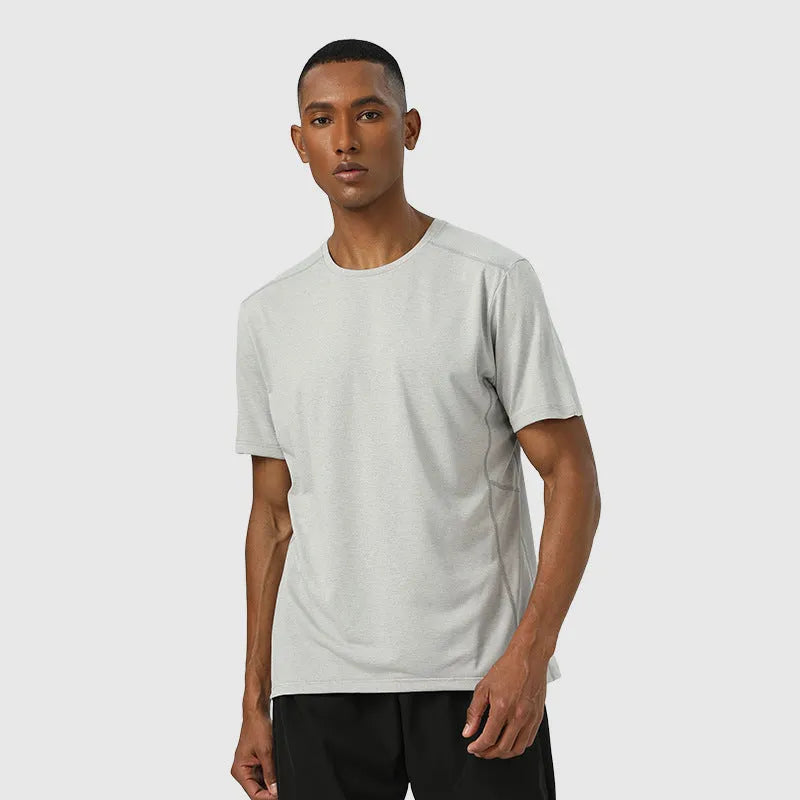 Man wearing a light grey quick-dry polyester short sleeve sport shirt with reflective details.