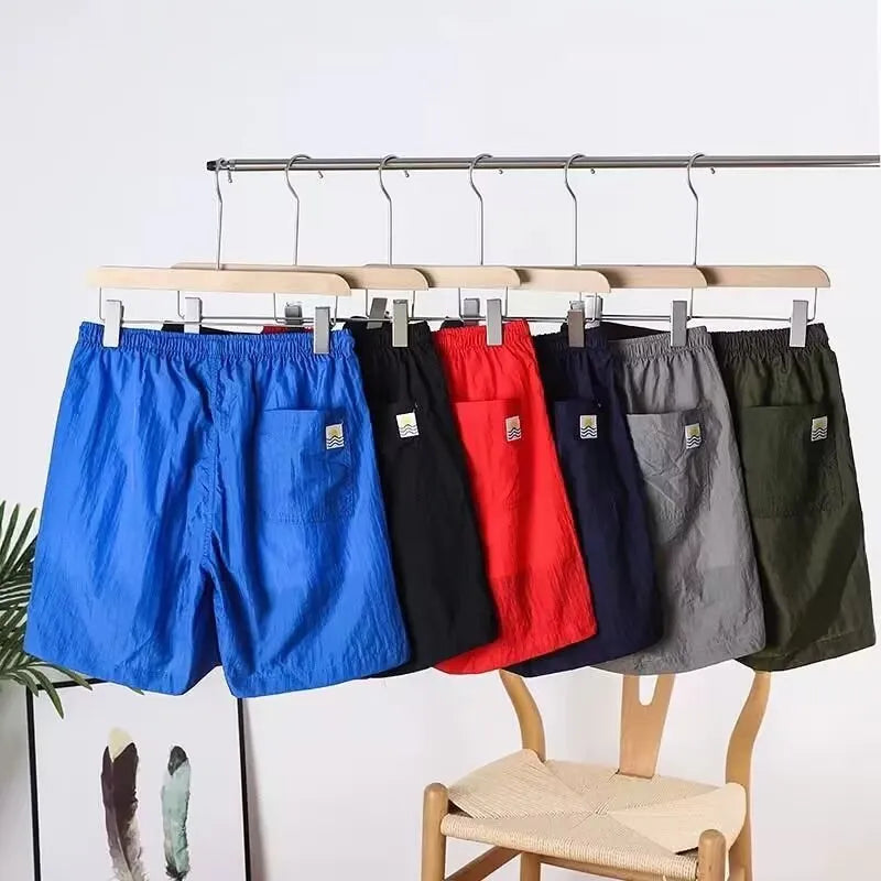 Men's straight-leg quick-drying sports shorts in chemical fibre blend fabric