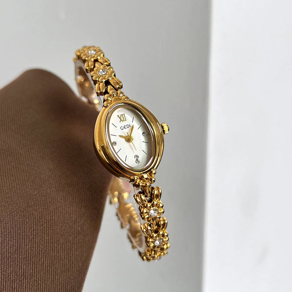 Women's compact alloy watch 8mm thick, one size, white or gold case with matching or contrasting dial and strap