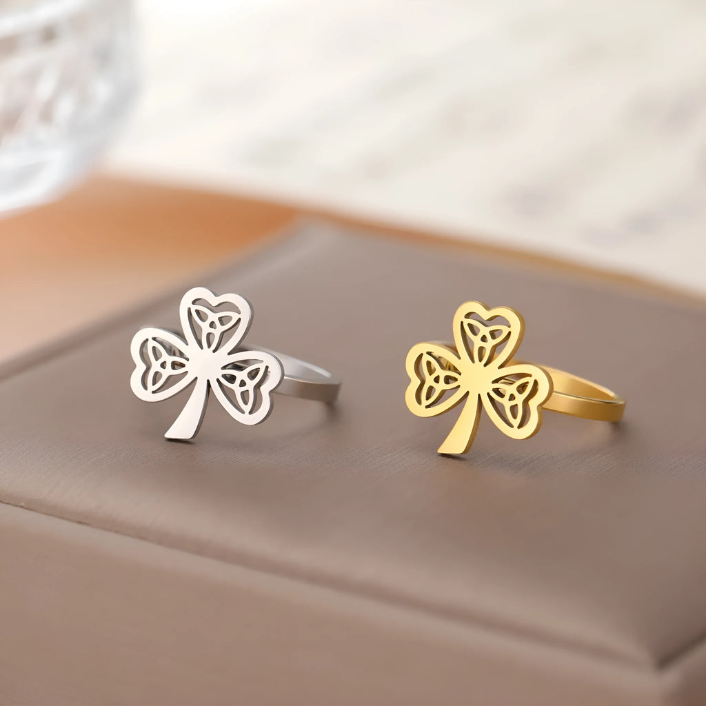 Stainless steel hollow ring shown in gold and steel colour finishes on hand