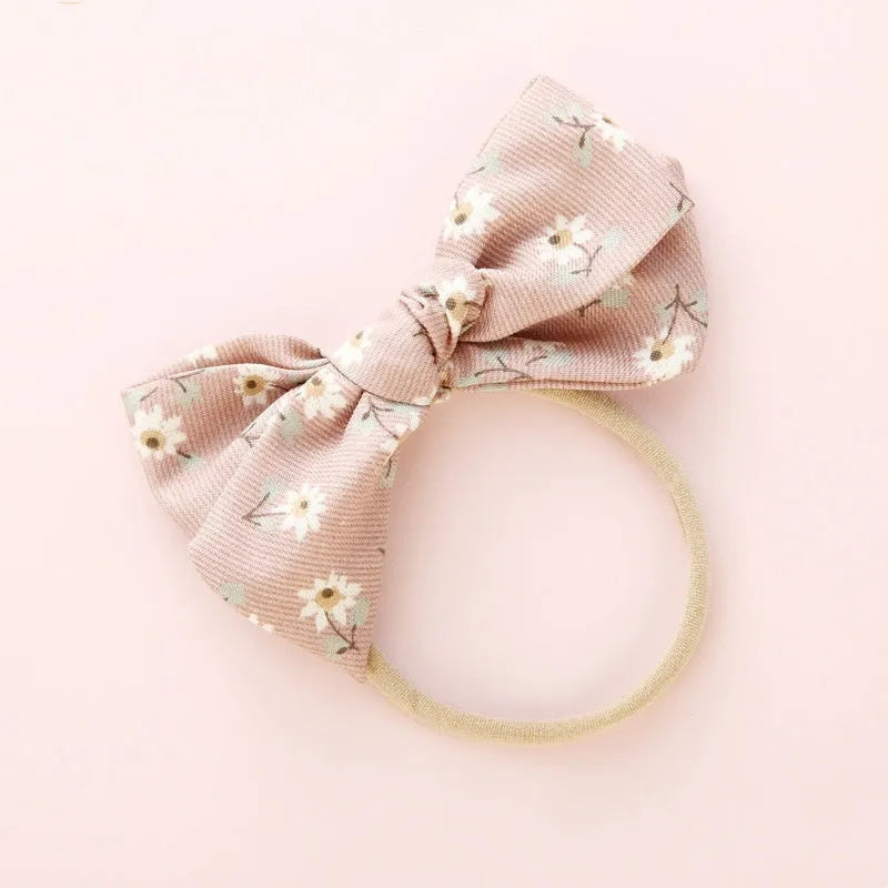Children's cloth knotted bow hair ring in a Snow White princess design.