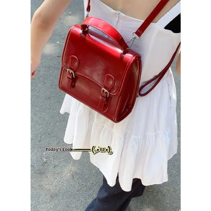 Simple PU college backpack in white, black, wine red, or silver with polyester lining and sewing thread detail