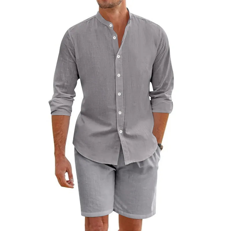 Men's dark grey hemp-blend short sleeve button-down shirt and matching drawstring shorts on a hanger.