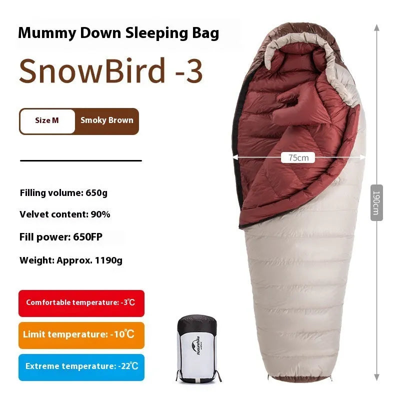 Adult mummy-style sleeping bag with goose down filling shown with its storage bag.