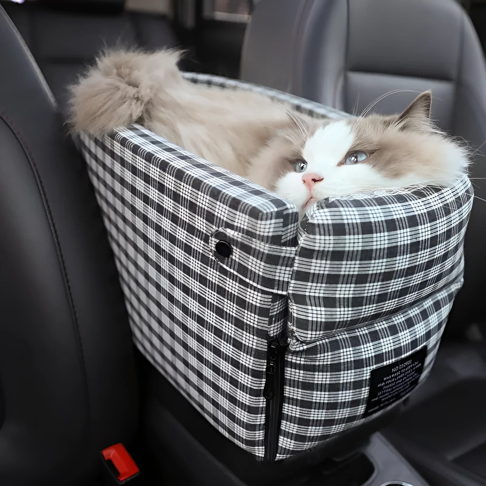 Portable pet car seat booster kennel in black grid with flip-top cover on car armrest, suitable for small dog or cat travel
