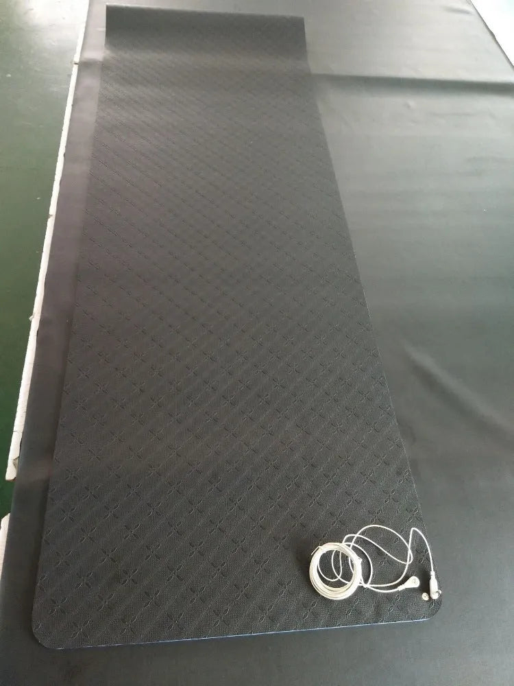 Blue conductive yoga mat with floral pattern, grounding wire, and non-slip surface.