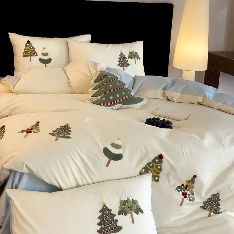 Cream blue duvet cover with embroidered Christmas tree and towel pattern, part of a pure cotton four-piece bedding set.