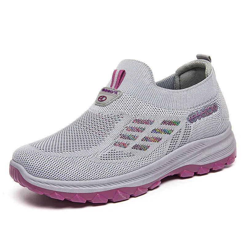 Women's flyknit slip-on casual shoes with mesh upper and PVC sole, shown in black, red, grey, and purple.