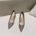 Silver and black women's wedding high heels with crystal detail on PU leather, showing stiletto and block heel options.