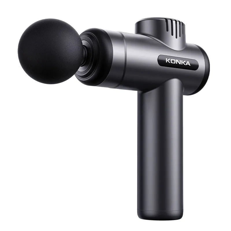 Konka V19 grey professional electric massage gun with set of eight different silicone massage heads on a table.