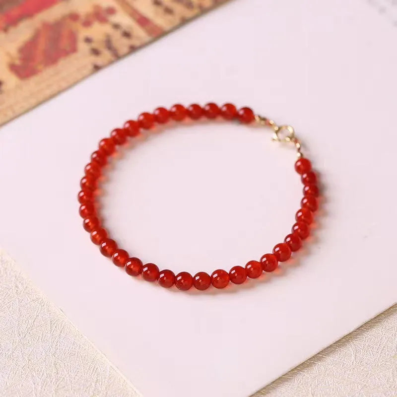 Ultra-thin classic red agate bracelet for women on a white background.