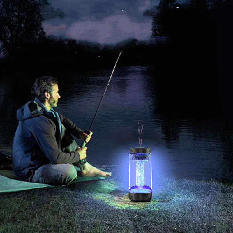 Black outdoor portable camping light Bluetooth speaker with LED colourful light on a natural background