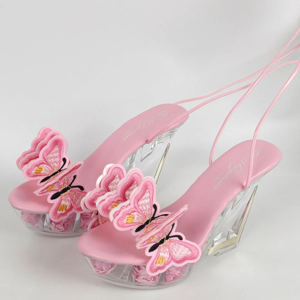 Black patent leather lace wedge high heels with 11cm heel, round toe, and crystal bottom detail.