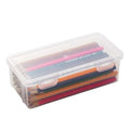 Clear transparent plastic storage box filled with coloured pencils and crayons with lid open.