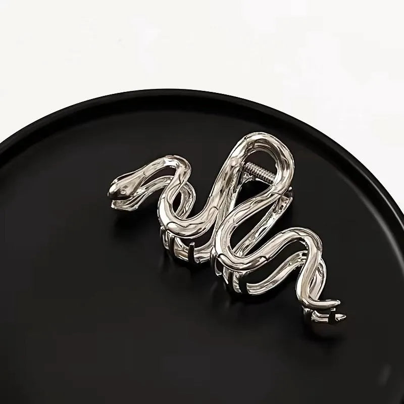 Slytherin serpentine snake design metal hair barrette in silver or gun black, measuring 10.5 cm.