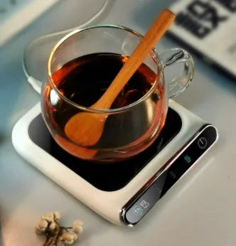 Black USB cup warmer with temperature controls and reminder light on desk