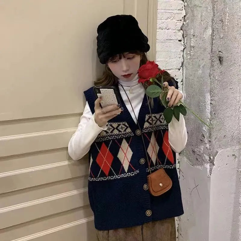 Loose sleeveless cardigan top in diamond plaid pattern, shown in khaki colour.