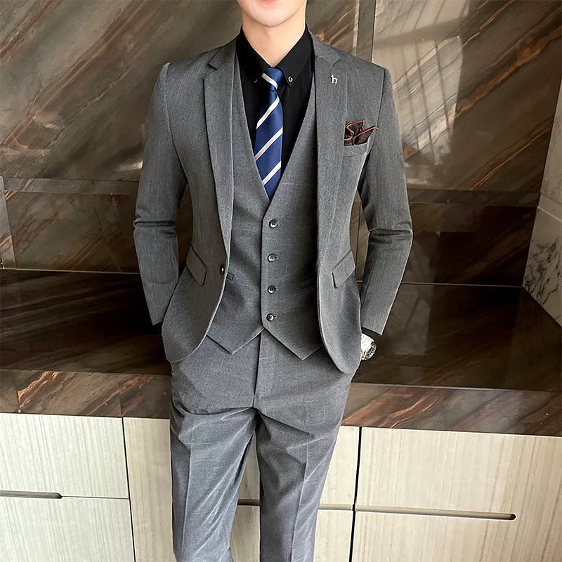 Slim fit men's business suit in British style available in black and dark grey colours