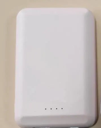 Magnetic wireless power bank in five colours: black, blue, green, pink, and white.
