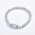 Myanmar jade bracelet with 8mm emerald colour round beads in geometric ethnic style design