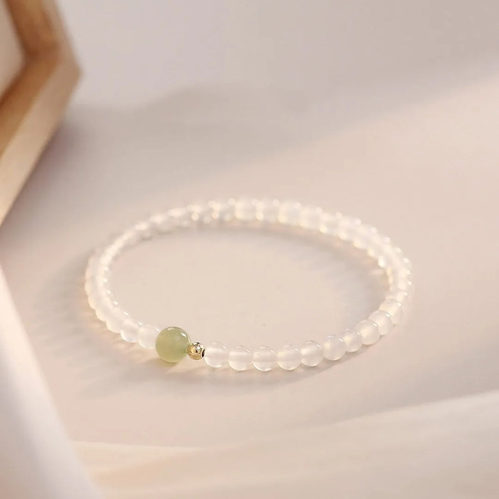 Natural white agate women's bracelet on wrist showing handmade beads and 15cm length.