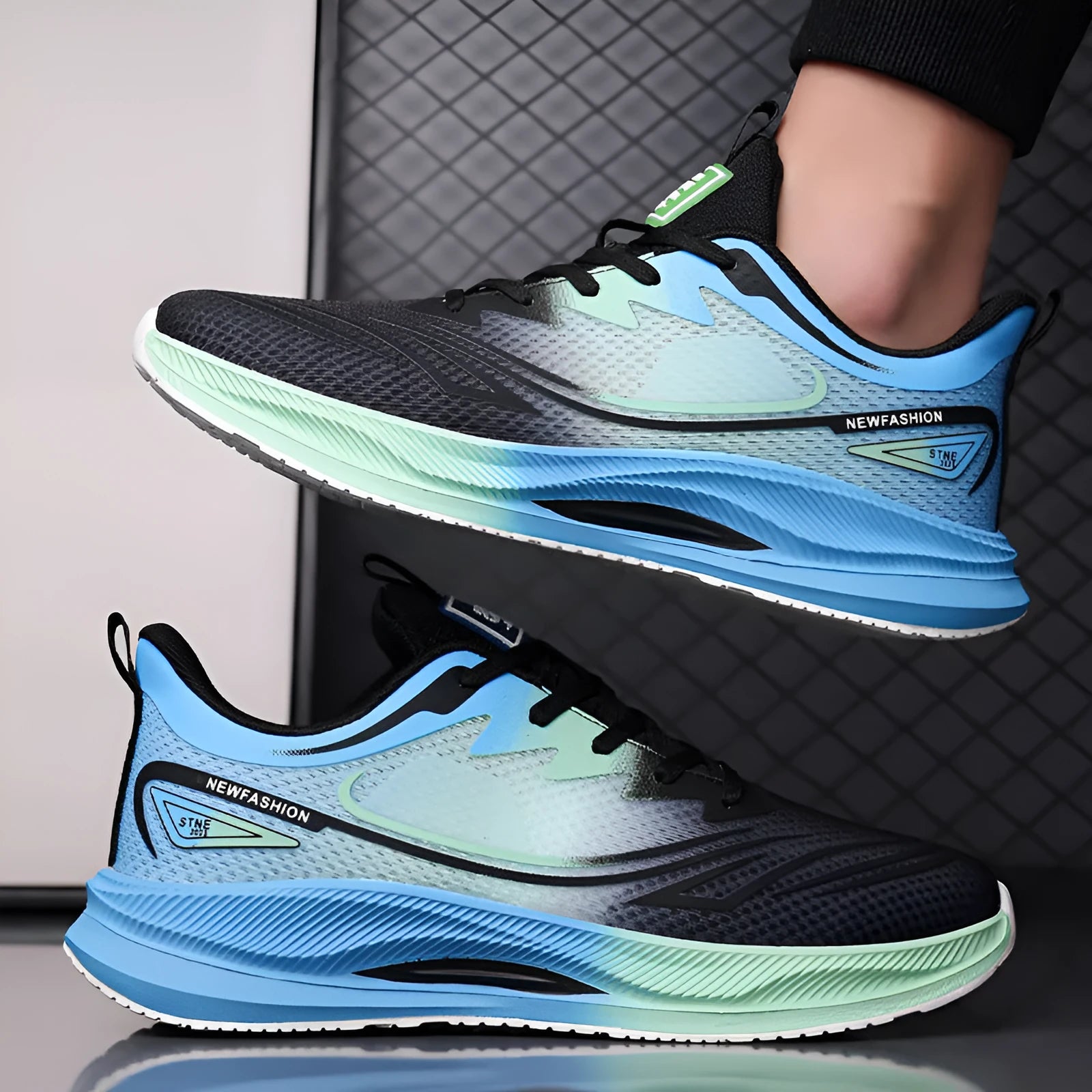 Men's Fly Woven Mesh casual shoes in grey and green, showing low-top design and rubber sole.