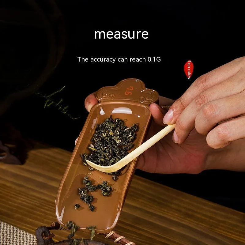 Electronic tea scale with wooden body, digital display, 200g range, and tea spoon accessory