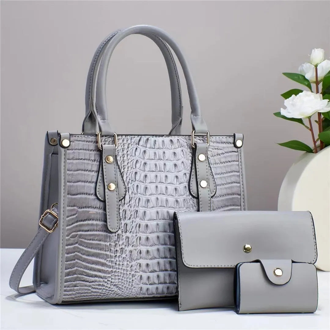 PU leather crossbody bag three-piece set showing bucket bag, wallet, and card holder in contrasting minimalist texture