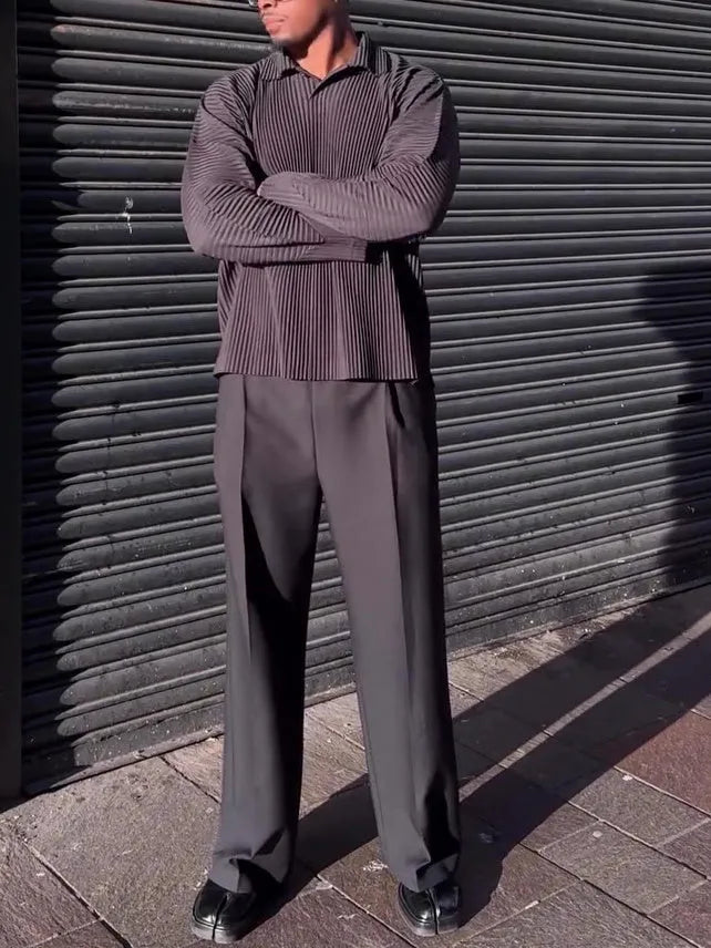 Man wearing a black pleated long-sleeved casual polyester top