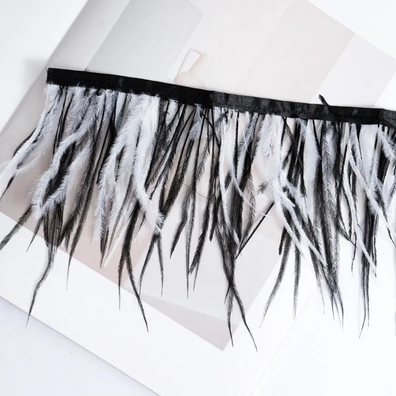 Decorative feather cloth strip in multiple colours including white, black, and mint green for DIY clothing and craft projects