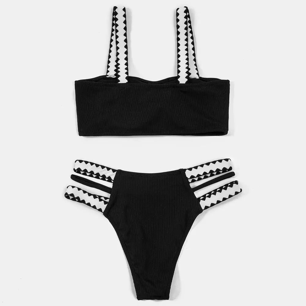 Black women's hollowed-out split swimsuit bikini set on mannequin