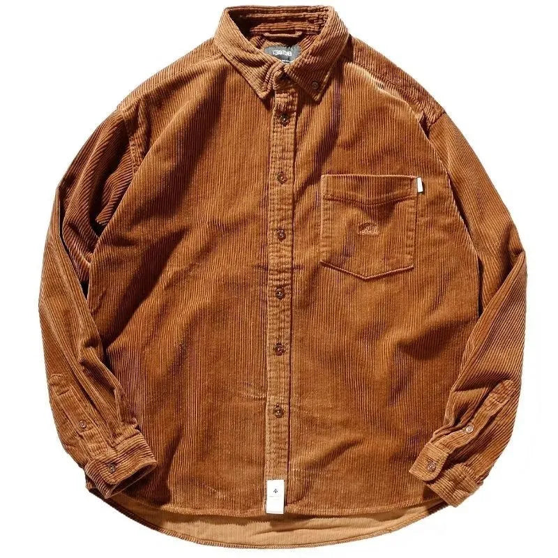 Man wearing a loose caramel corduroy shirt in Japanese Hong Kong style.