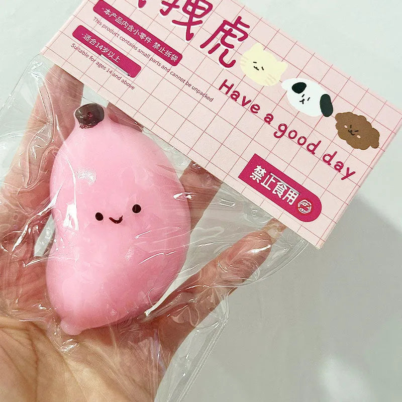 Chubby Banana Squeezing Toy in pink and green TPR material for stress relief