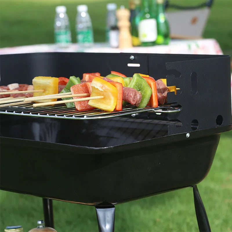 Portable metal barbecue oven with black grill rack, 29x12x44cm, for camping and outdoor use, serving 3-5 people.