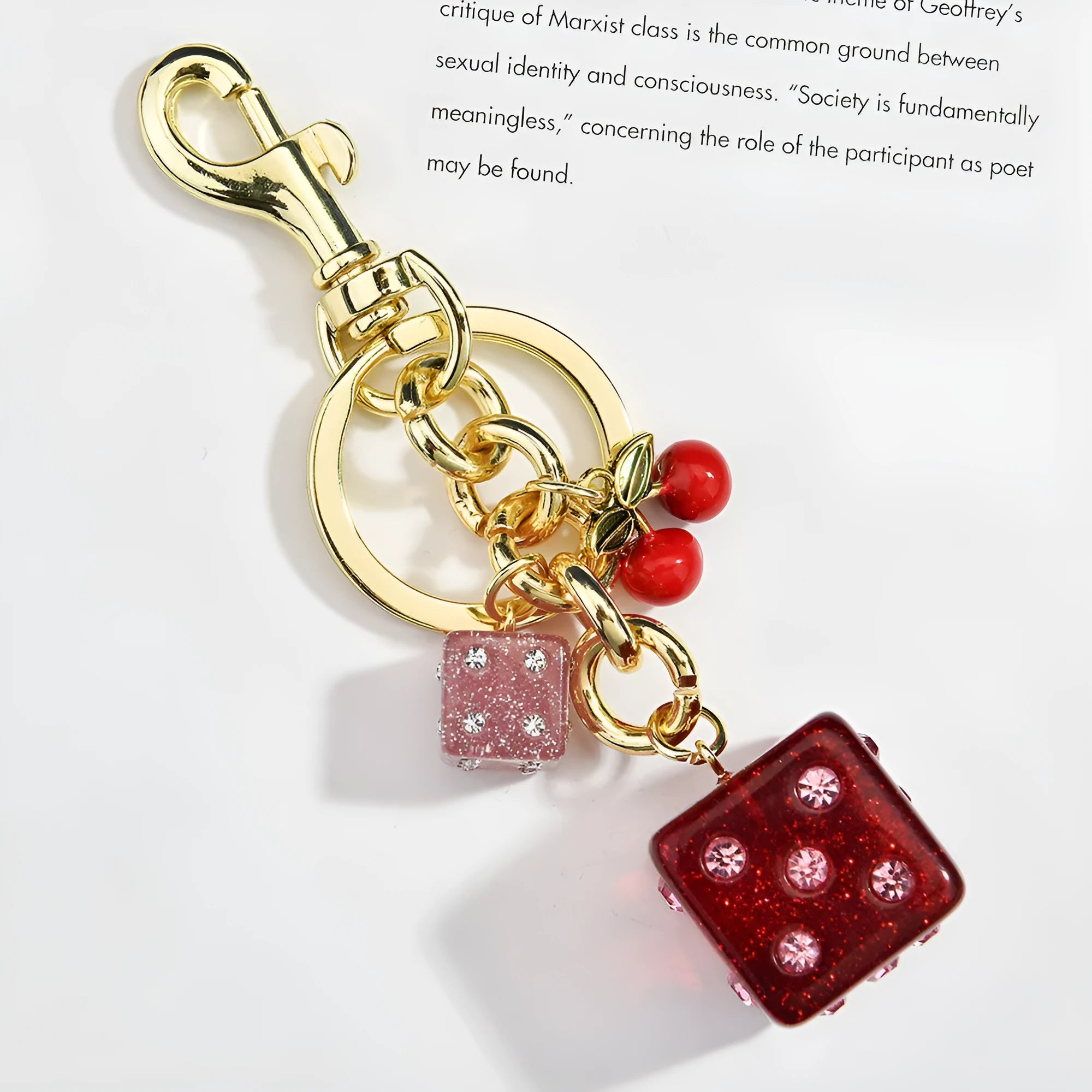 Square cherry red and silver dice pattern metal keychain pendant on a key ring