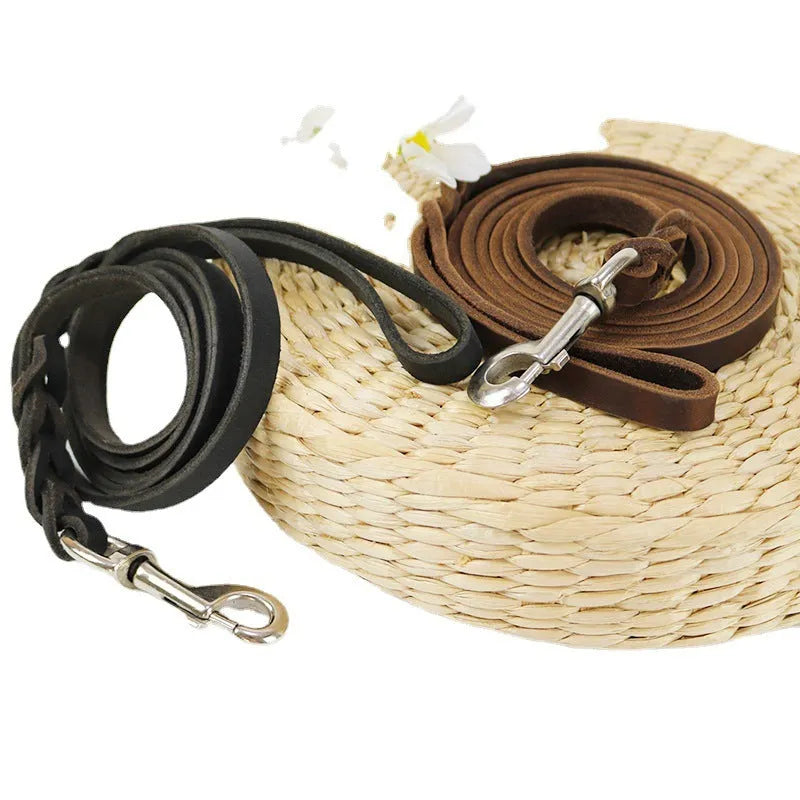 Light brown cowhide dog walking rope with leather hand loop, shown at full length.