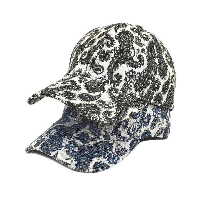 Paisley pattern printed baseball cap in blue with dome crown style on a white background.