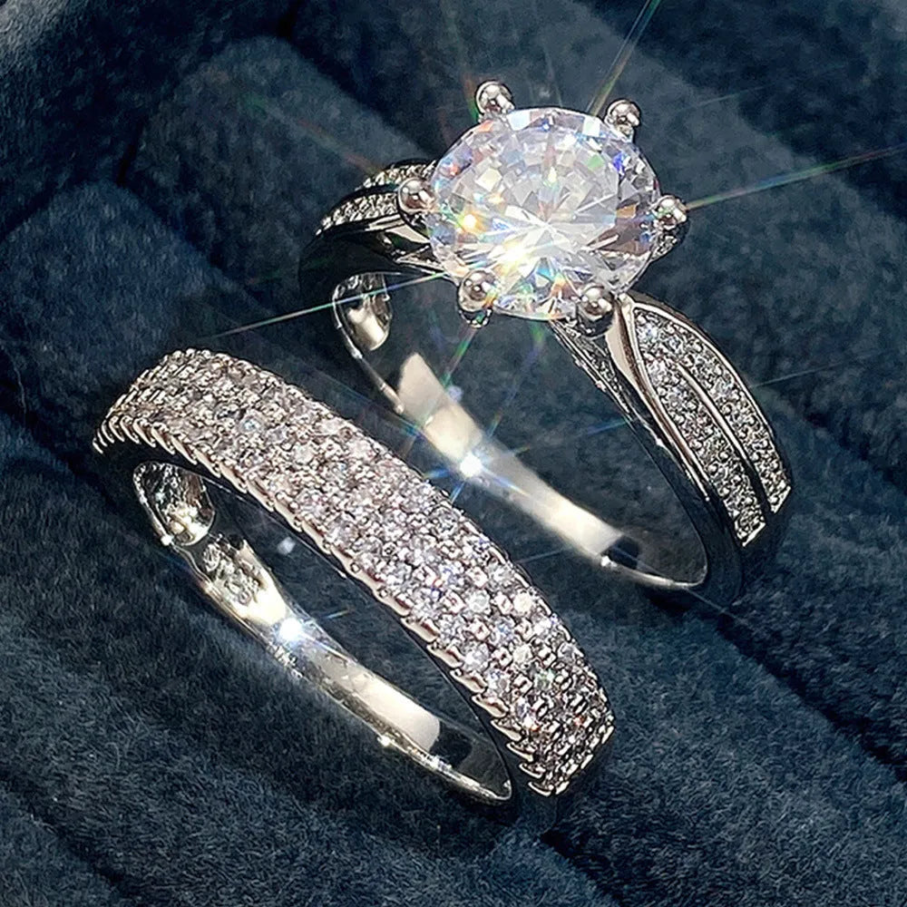 Geometric white gold colour alloy ring and bracelet combined into one continuous piece on a model's hand.