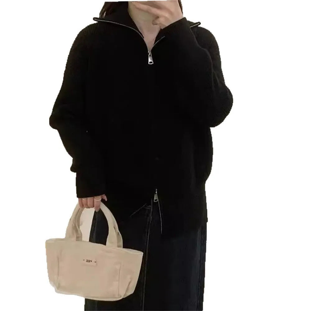 Grey Hong Kong style knitted cardigan with double zipper and floral pattern.