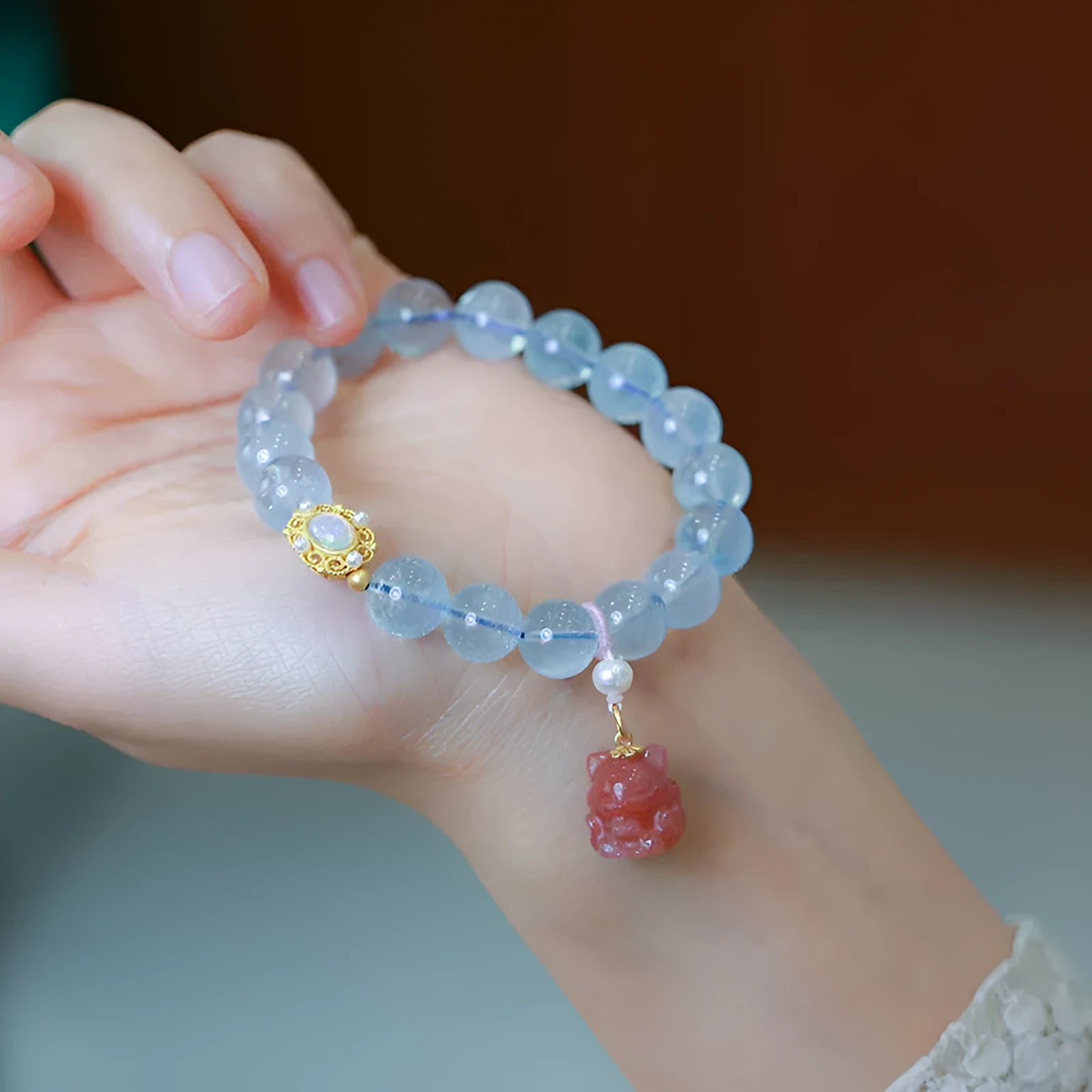 Aquamarine DIY bracelet for women with Fengjiu fox charm, showing pearl and crystal design options.