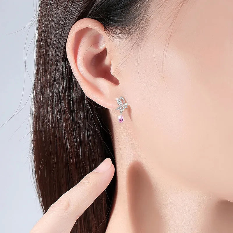 Women's sterling silver butterfly stud earrings with crystal accents on white background