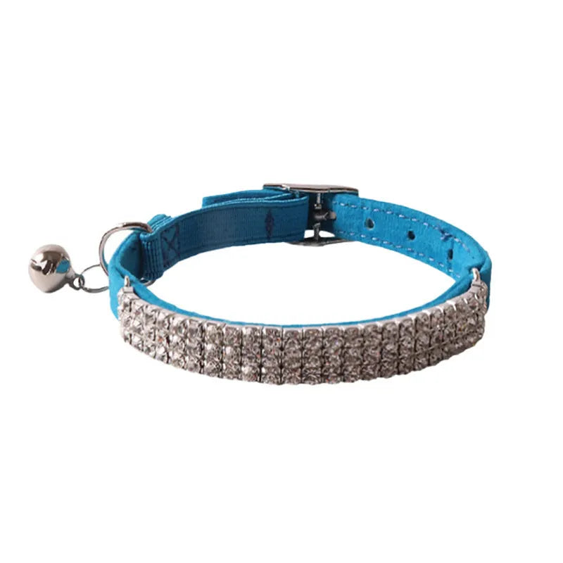 Flocked fabric cat collar with elastic buckle and gang drill pattern in multiple colours.