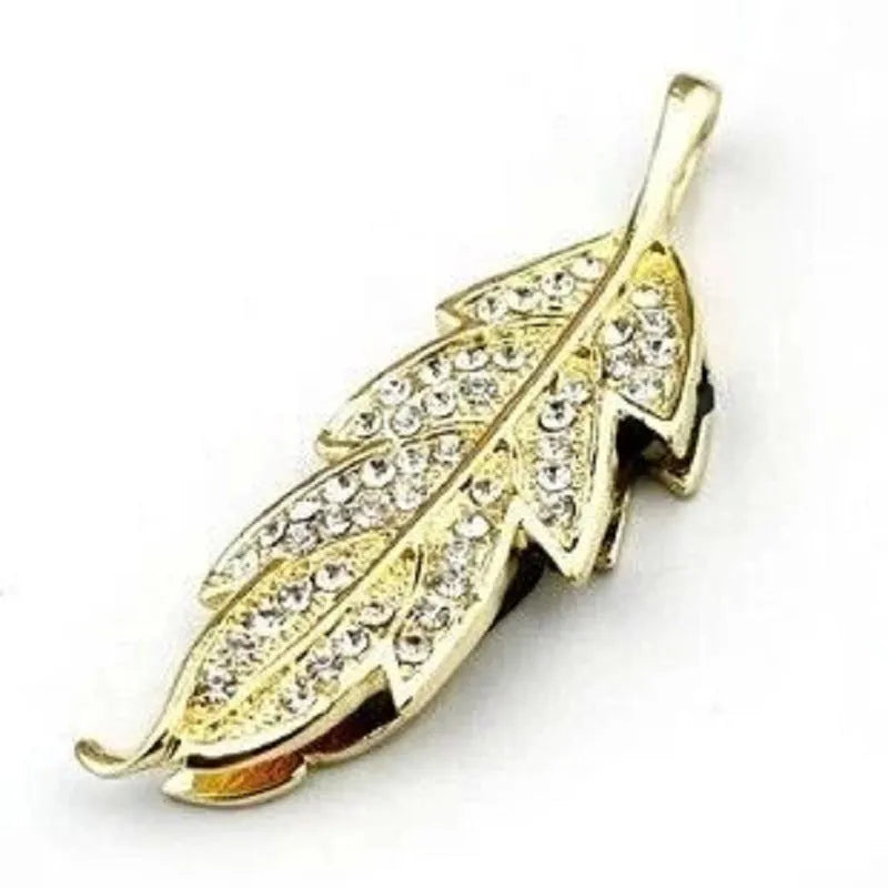 Silver metal USB flash drive shaped like a crystal maple leaf on a white background.