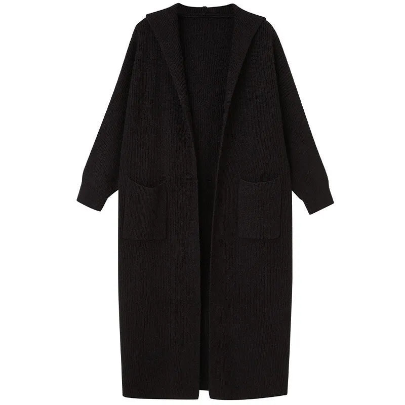 Long grey knitted cardigan coat with long sleeves on a hanger.